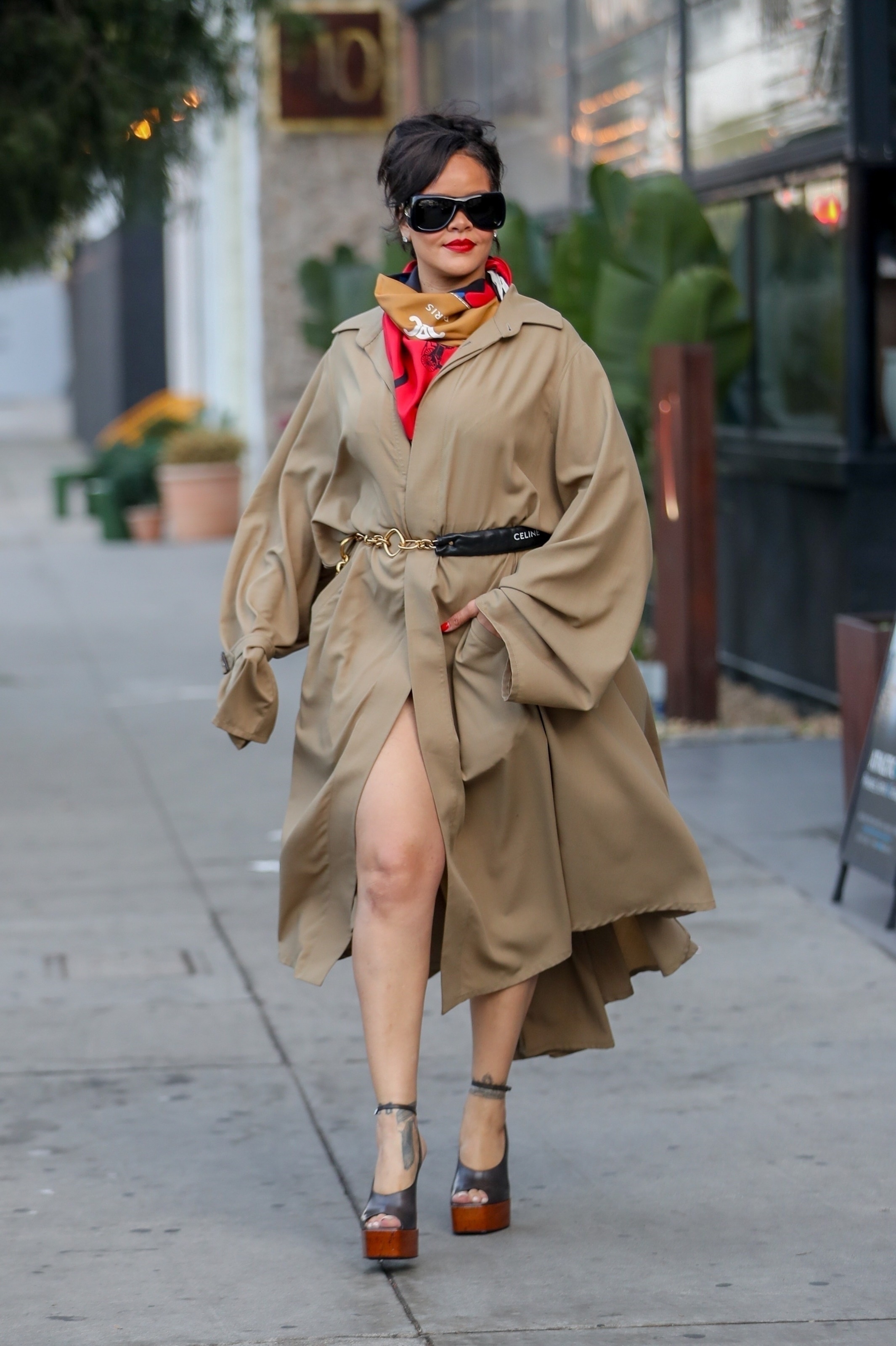 Rihanna wears two totally different outfits in one day, including a head-to-toe black look and a duster coat