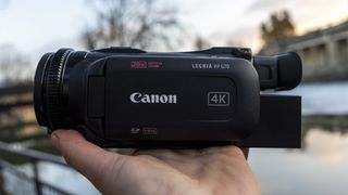 A side view of the Canon HF G70 camcorder in the blue hour