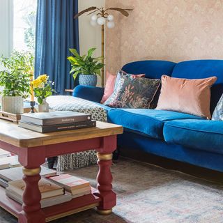 living room with blue velvet sofa