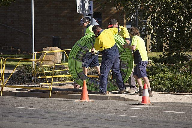 Cable crew laying fiber