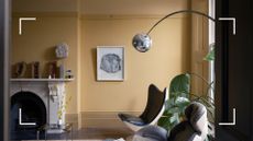 Yellow living room with contemporary furniture showcasing Farrow & Ball's gradient layering paint trend