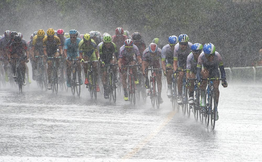 The peloton is drenched in the downpour