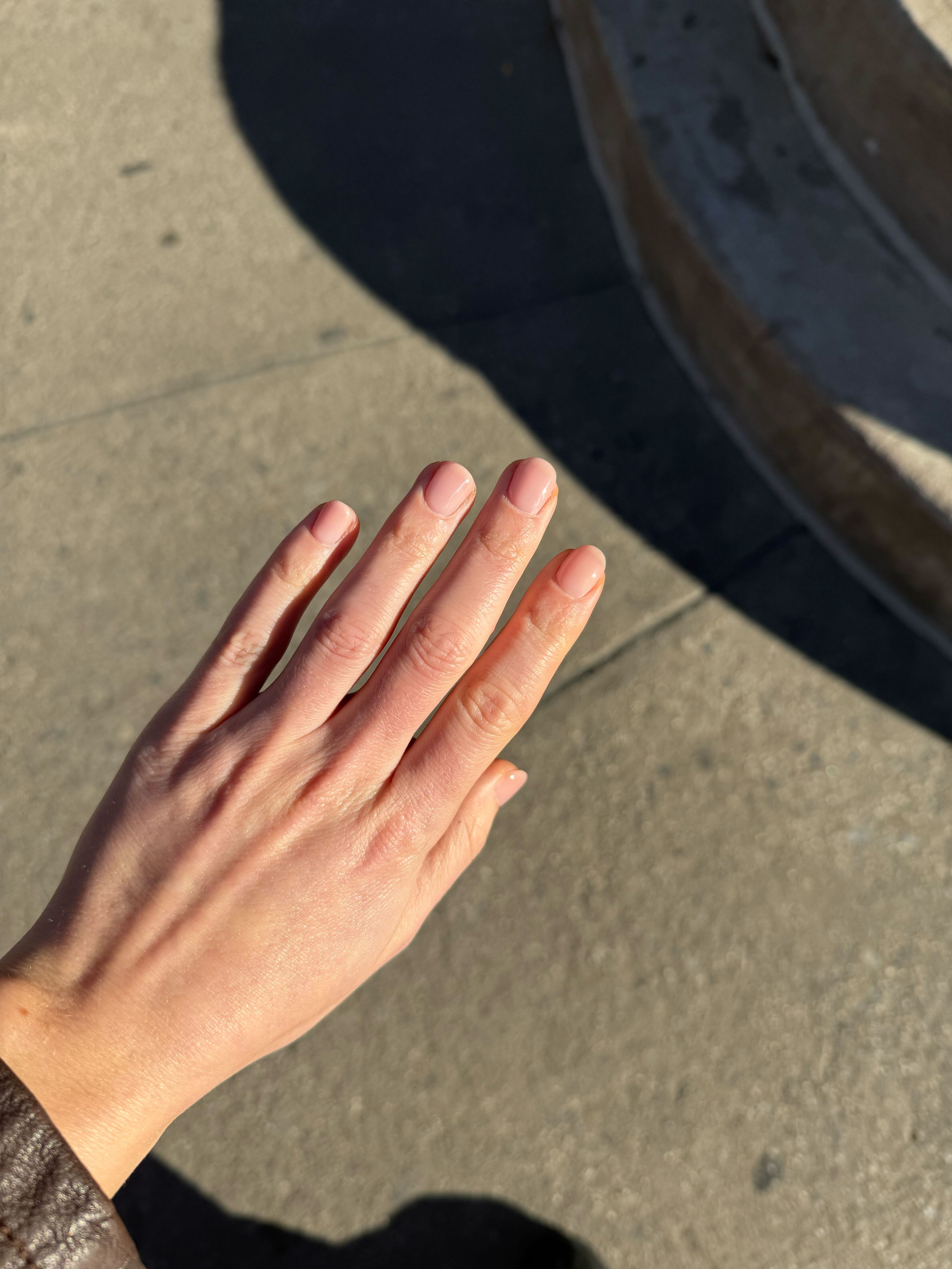 Photo of Jamie Schneider's nails one week after getting Japanese gel