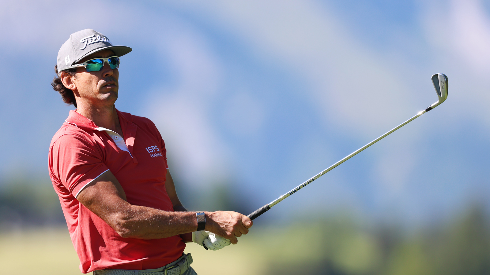 Rafa Cabrera Bello hits an iron and watches it