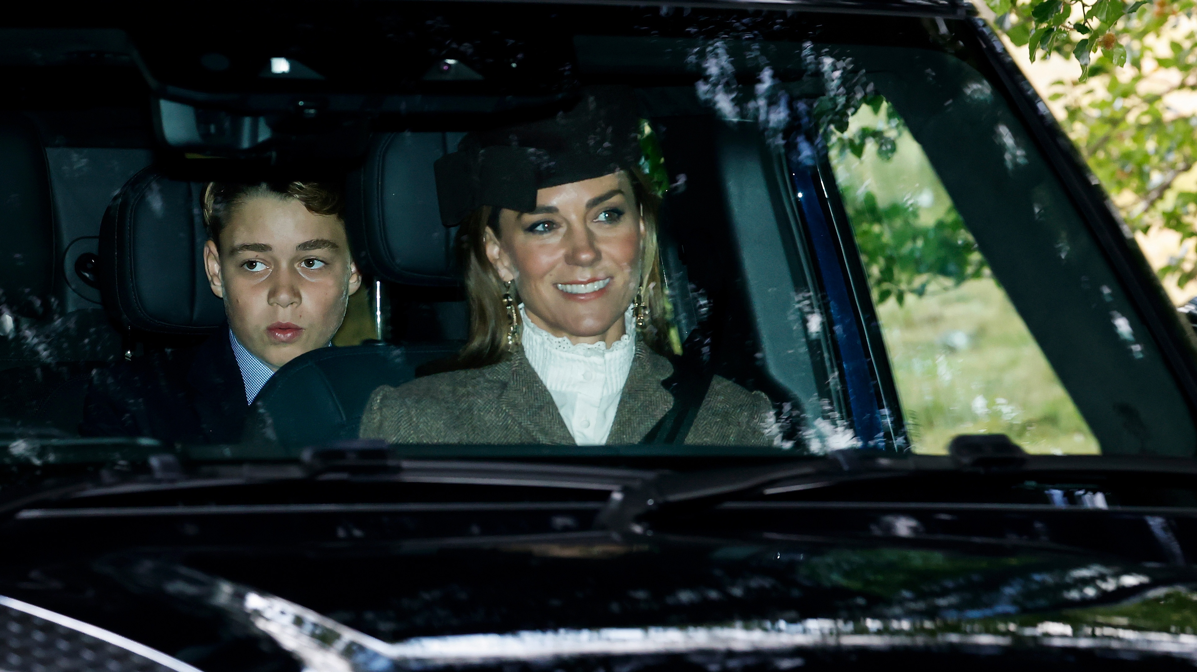 Prince George and Catherine, Princess of Wales arrive in a car ahead of a service at Crathie Kirk Church on August 23, 2026
