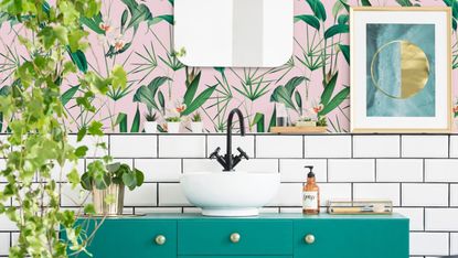 green and pink bathroom with tropical wallpaper