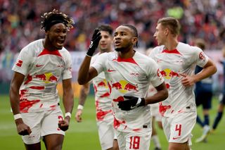 Christopher Nkunku of RB Leipzig celebrates after scoring their team's second goal from the penalty spot during the Bundesliga match between RB Leipzig and VfL Bochum 1848 at Red Bull Arena on October 01, 2022 in Leipzig, Germany.