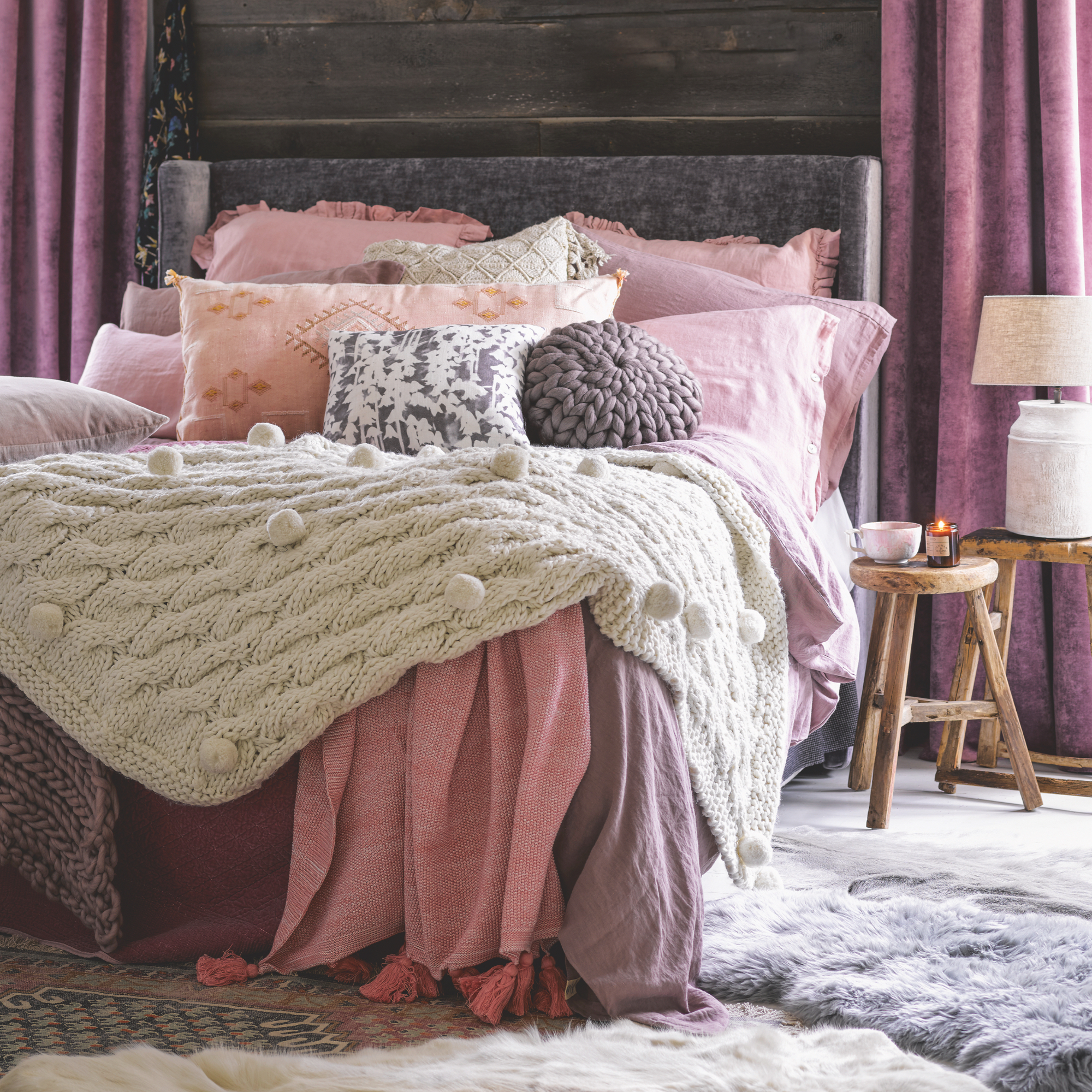 bedroom with bedding, throws and pillows