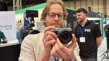 Mike Harris handling Fujifilm X-M5 on trade-show floor 