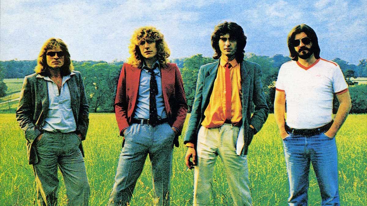 Led Zeppelin standing in a field