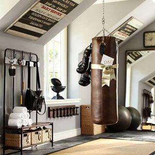 home gym with white wall and punching bag