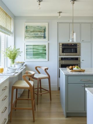 blue and white decor in a kitchen with stools in natural materials