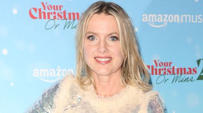 Baker Juliet Sears in a sparkly Christmas dress with a feathered collar