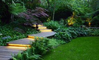 how much does garden lighting cost?: illuminated steps in garden designed by Andrew Wenham MSGD