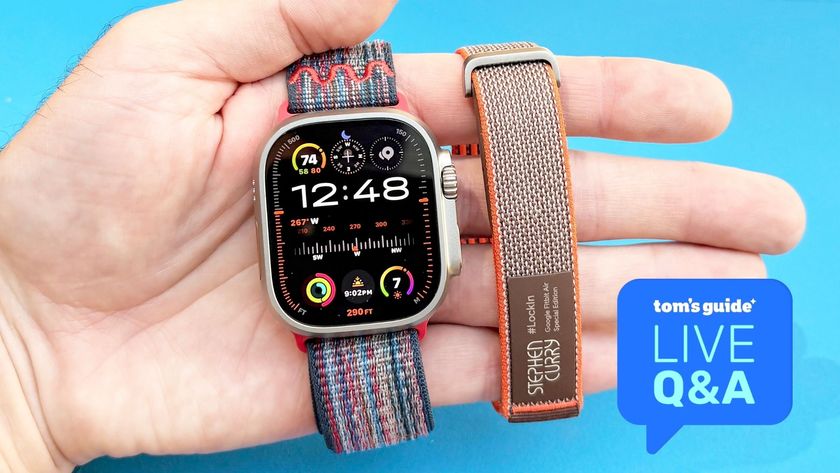 A hand holding the Apple Watch Ultra 3 and Fitbit Air, with a graphic reading 'Tom's Guide Live Q&amp;A'