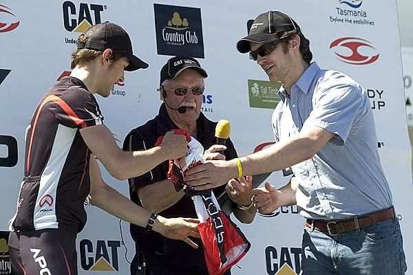 Peter Braunsteins (Apollo Bicycles) is presented with his Goodstone Group most aggressive riders jersey by a CAT representative in George Town.