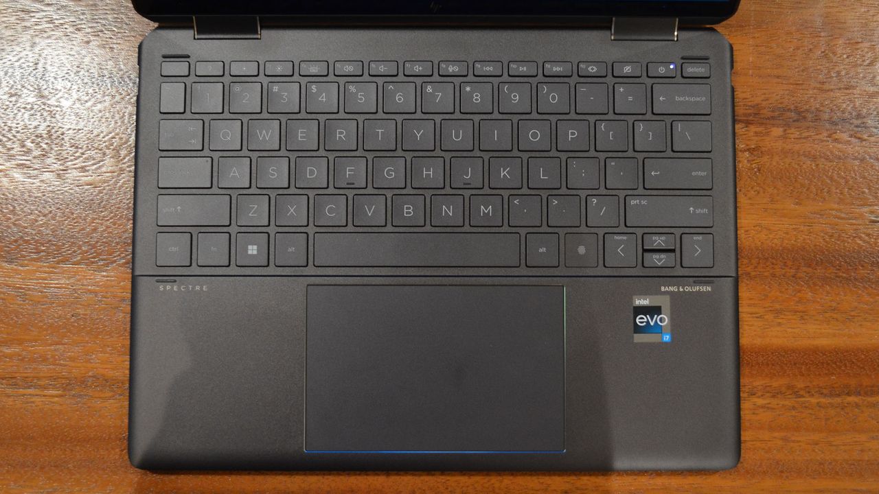 An HP Spectre x360 2022 on a wooden table