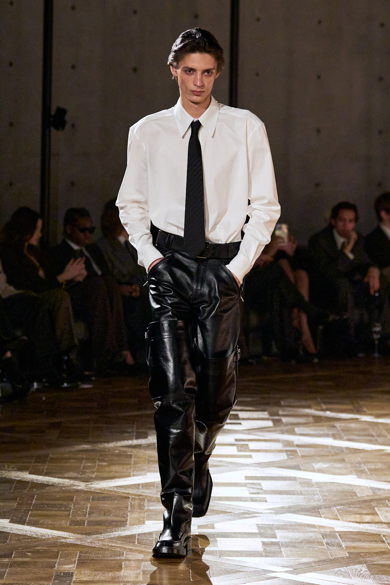 A model wore Robbie G.K.'s look on the Saint Laurent Fall 2025 runway