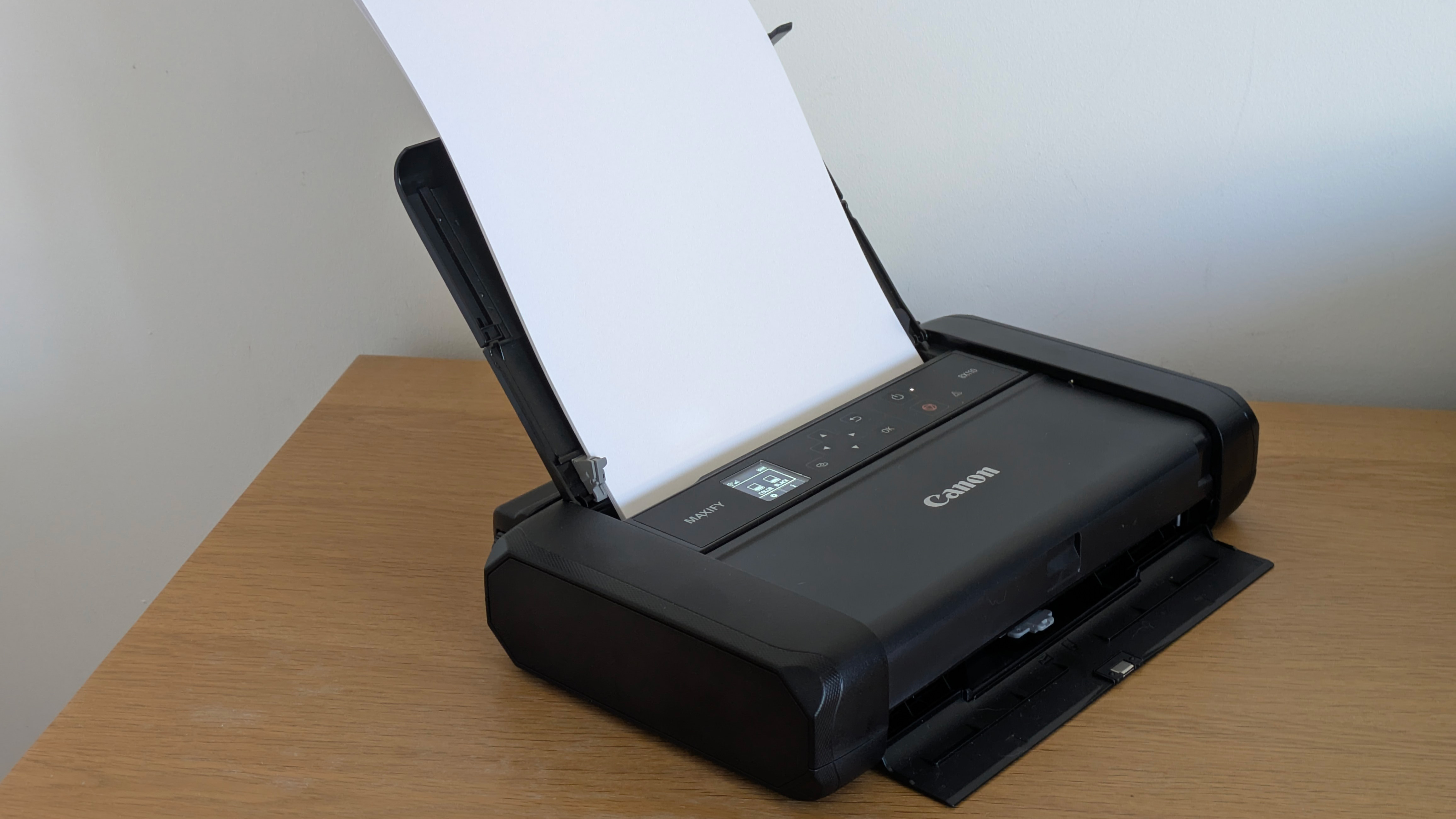 The Canon MAXIFY BX110 on a desk