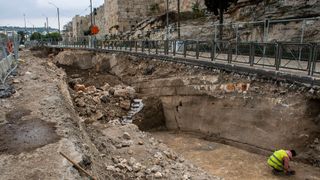 Workers excavating a moat discovered in Jerusalem.