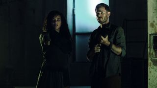 "Killjoys'" main characters Dutch (left, played by Hannah John-Kamen) and John (Aaron Ashmore), are employed by the Recovery and Apprehension Coalition or RAC, which requires that they remain apolitical.