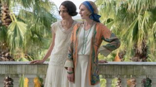 Tuppence Middleton and Laura Carmichael standing in a French villa in Downton Abbey: A New Era.