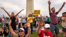 Participants gather on the mall for a Christian rally.