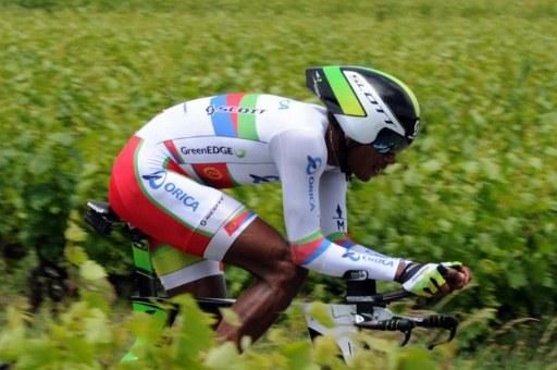 Daniel Teklehaimanot (Orica-GreenEdge) rides through the fields in the Dauphine