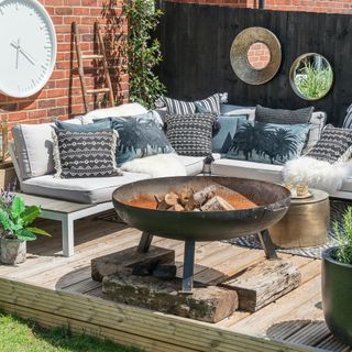 outdoor seating with sofa and firepit