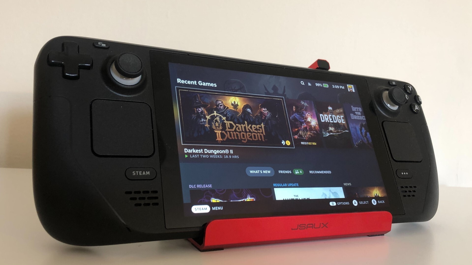 JSAUX USB 6-in-1 Steam Deck Dock with a Steam Deck on it, displaying the Steam page for Darkest Dungeon