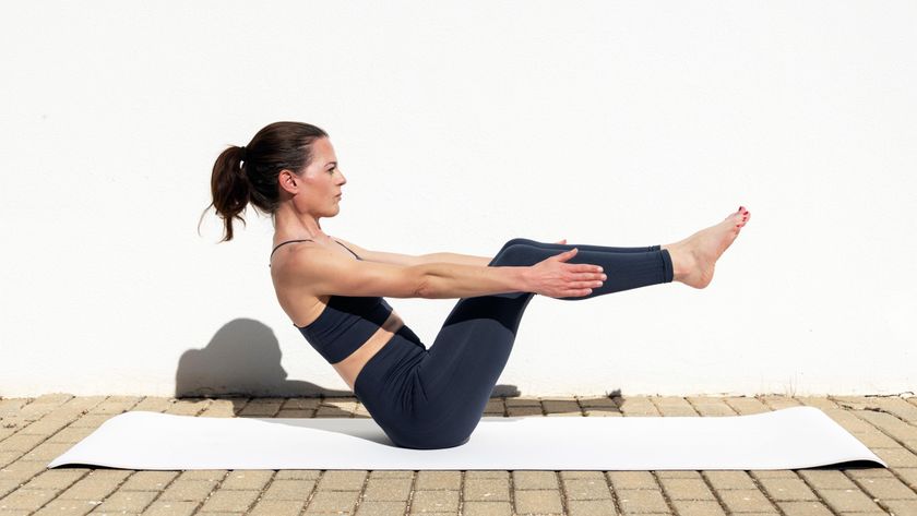 a woman doing the boat pose