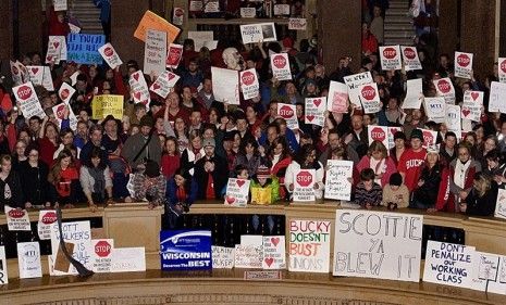 For a third day, protesters continue rallying against Gov. Scott Walker&amp;#039;s bill to cut public sector budgets, which was delayed after Democrat state senators fled the Wisconsin capital. 