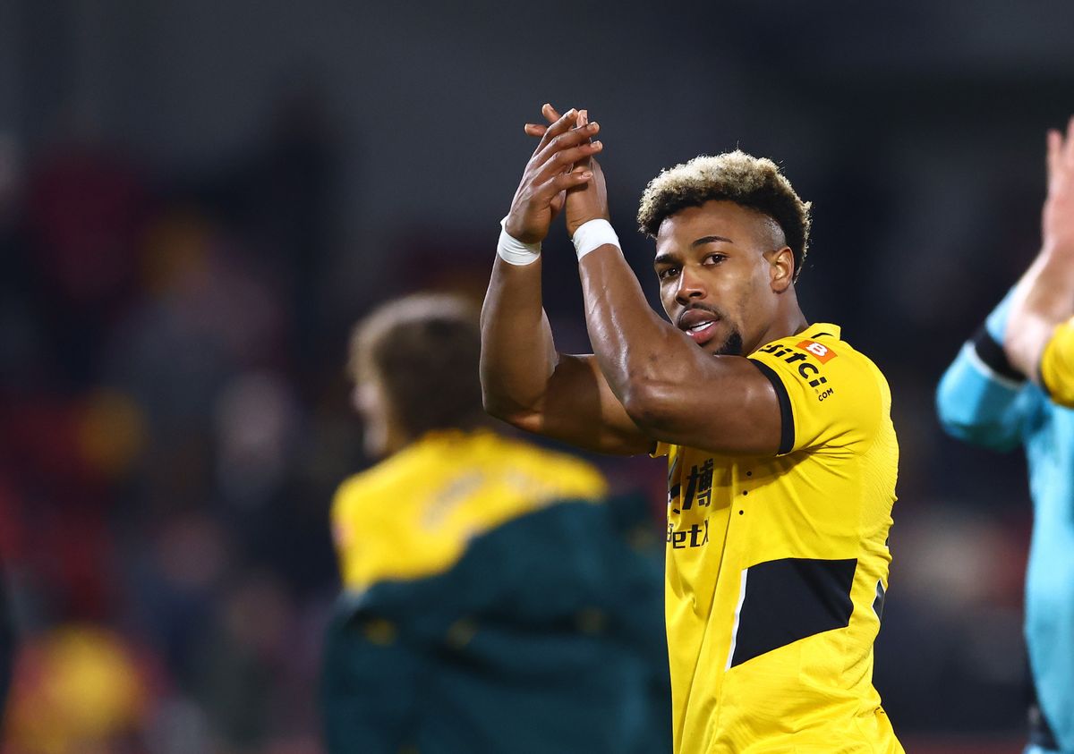 Wolves winger Adama Traore applauds the fans