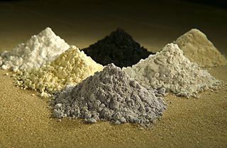 These rare-earth oxides are used as tracers to determine which parts of a watershed are eroding. Clockwise from top center: praseodymium, cerium, lanthanum, neodymium, samarium, and gadolinium.