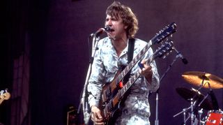 American Rock musician Joe Walsh plays guitar as he performs onstage at the US Festival, Ontario, California, May 30, 1983.