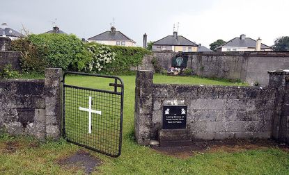 This picture shows a shrine in Tuam, County Galway on June 9, 2014, erected in memory of up to 800 children who were allegedly buried at the site of the former home for unmarried mothers run 
