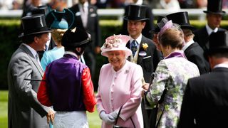 Queen Elizabeth II is welcomed upone her arrival on day 2 of Royal Ascot