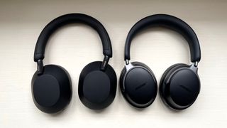 Bose QC Ultra Headphones with Sony WH-1000XM5 on a wooden bench