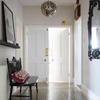 corridor with silhouette bench corolla pendant and floor tiles