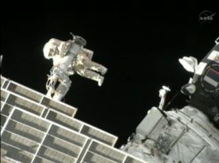 Russian cosmonaut Gennady Padalka is seen at the end of the International Space Stations' Strela crane during a spacewalk on Aug. 20, 2012.