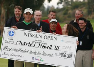 Howell with a big cheque