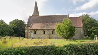 A church with spire and south facing roof