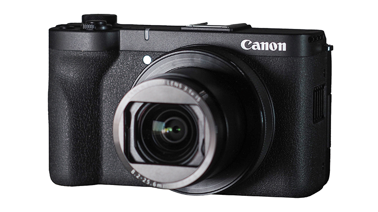 Canon compact camera against a white background