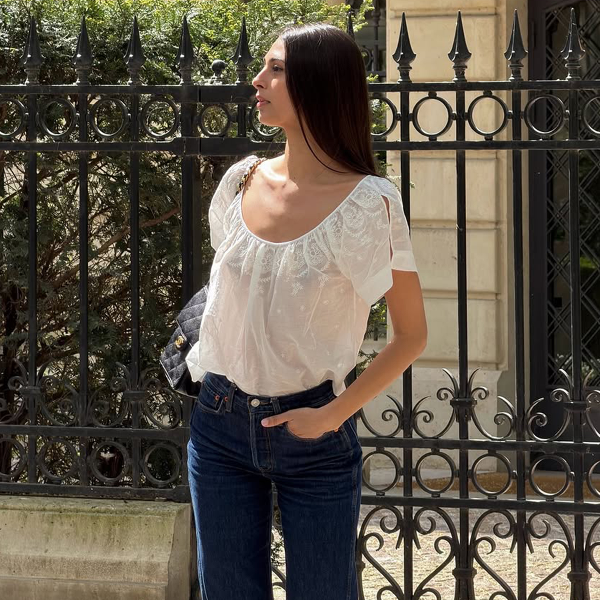 Salome Mory wearing jeans and a white top in Paris