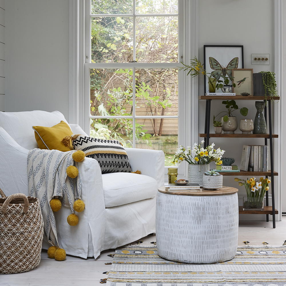 white chair near white window