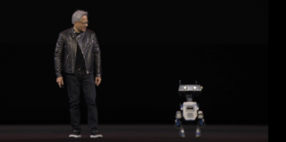 Jensen Huang with a robot on stage at GTC.