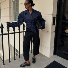 An image of influencer @nlmarilyn wearing a typical London trainer outfit.