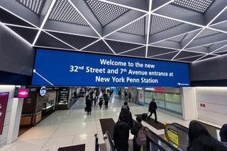 The new SNA Displays LED video wall welcomes visitors at New York Penn Station.