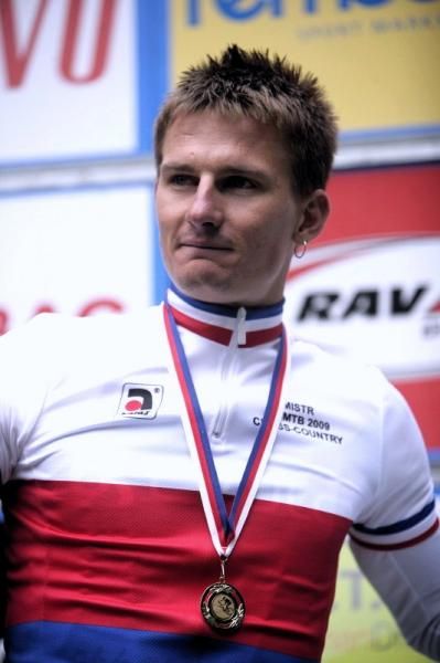 Pavel Boudny with his medal on the podium.