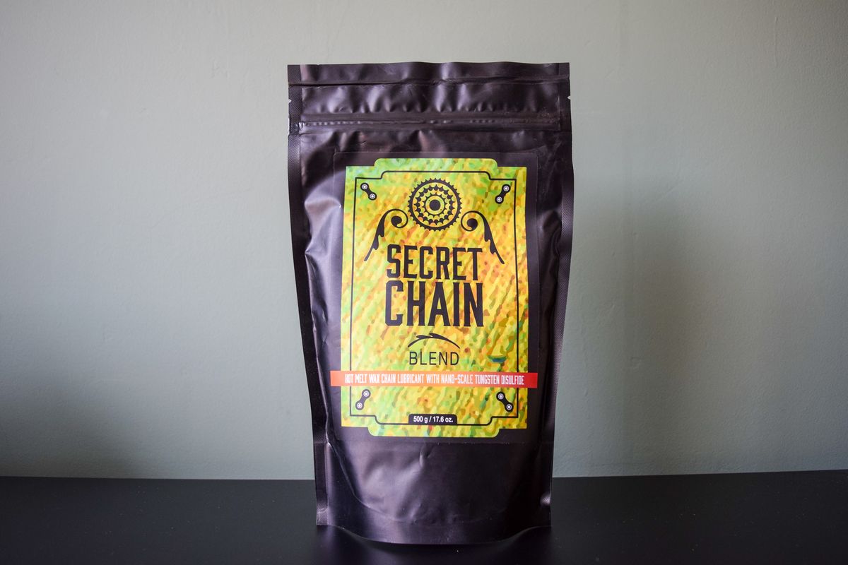 A bag of Silca Super Secret chain wax on a metal worktop